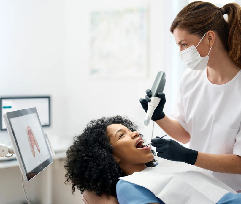 Patient being scanned with an intraoral scanner